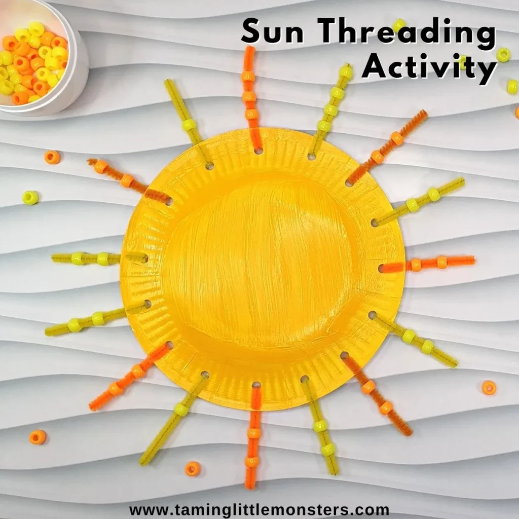 A yellow paper plate, with orange and yellow pipe cleaners attached. It looks like the sun!